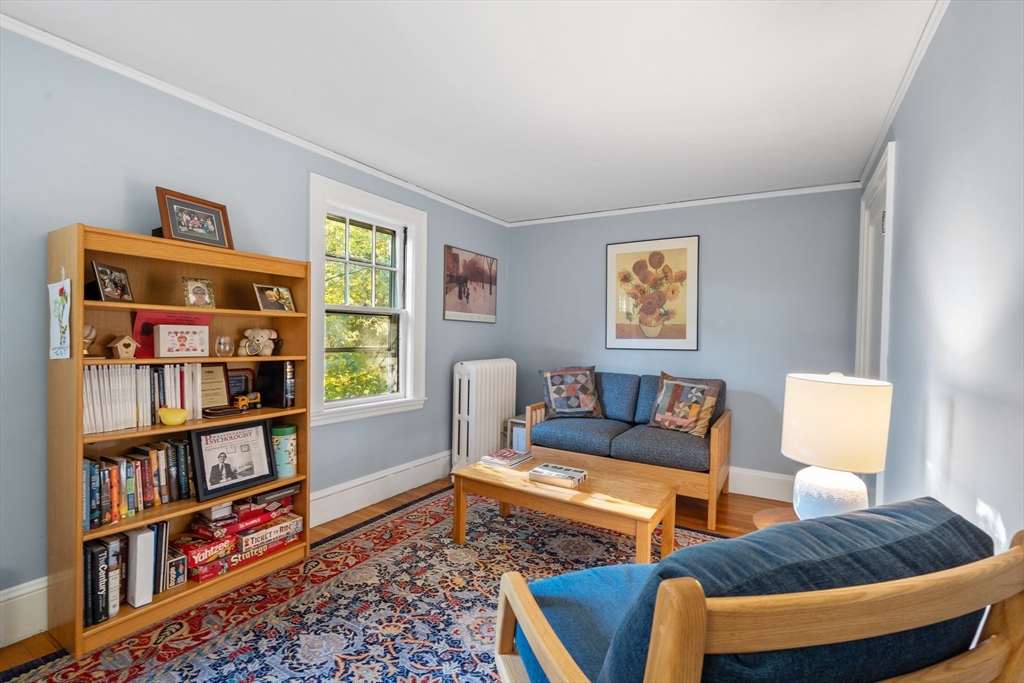 30 Burlington Street Lexington, MA 02420 - Photo 25 of 34 a living room with furniture and a book shelf