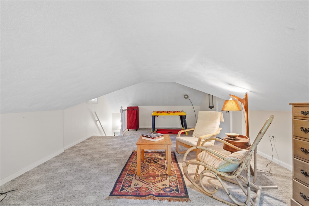 30 Burlington Street Lexington, MA 02420 - Photo 28 of 34 a living room with furniture and a rug