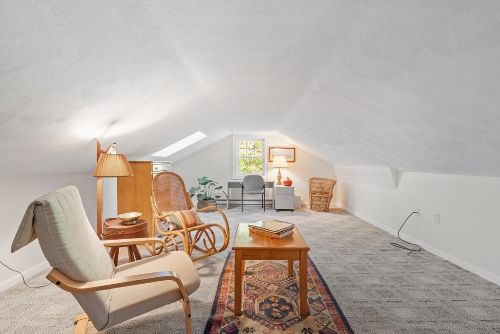 30 Burlington Street Lexington, MA 02420 - Photo 29 of 34 a living room with furniture and a large window