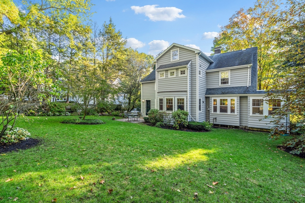 30 Burlington Street Lexington, MA 02420 - Photo 30 of 34 a front view of a house with a garden