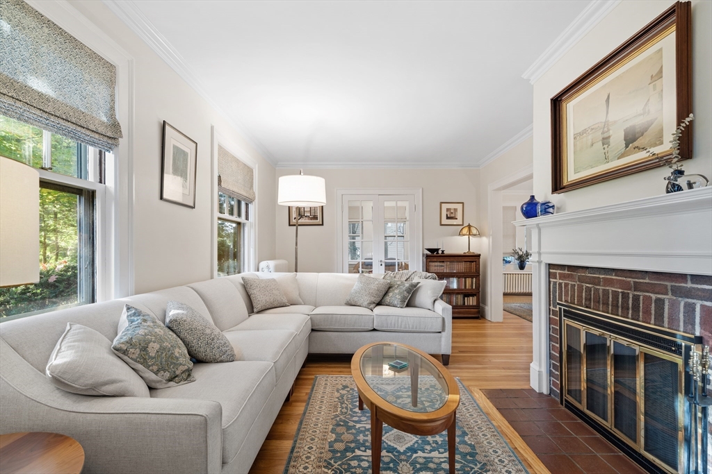30 Burlington Street Lexington, MA 02420 - Photo 4 of 34 a living room with furniture a fireplace and a large window