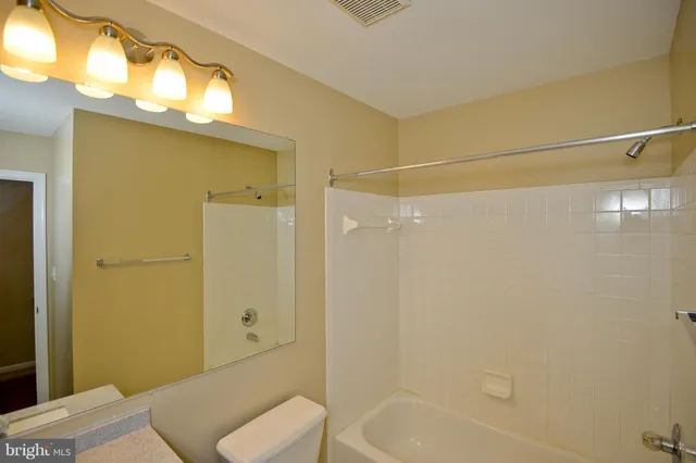 a bathroom with a sink and shower