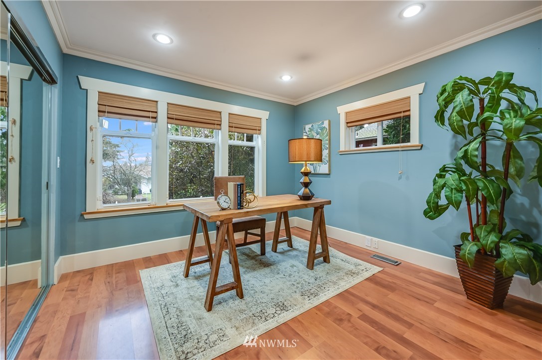 6016 44th Avenue Southwest Seattle, WA 98136 - Photo 12 of 35 a workspace with furniture window and wooden floor