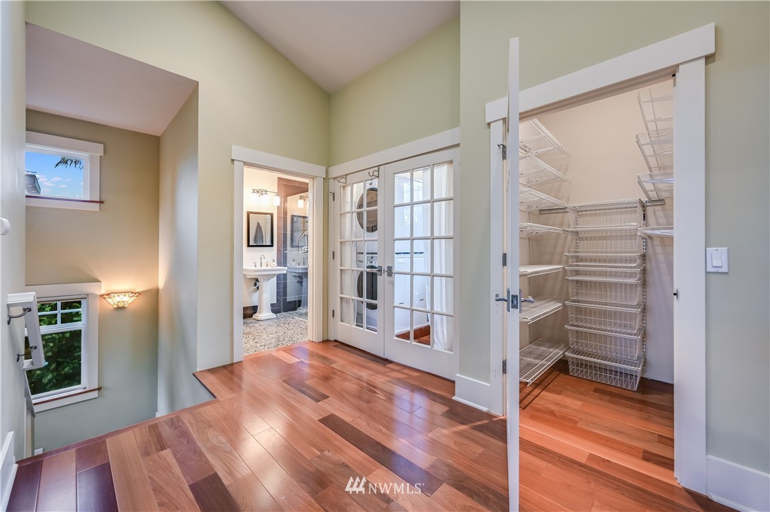 6016 44th Avenue Southwest Seattle, WA 98136 - Photo 15 of 35 a view of an entryway with wooden floor and a bedroom
