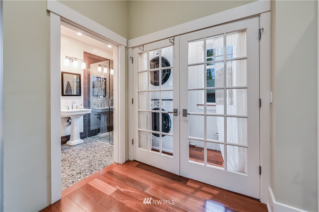 6016 44th Avenue Southwest Seattle, WA 98136 - Photo 16 of 35 a view of a hallway with wooden floor and entryway
