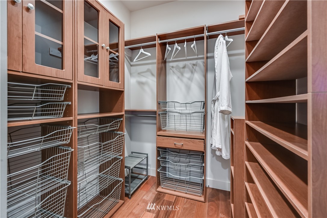 6016 44th Avenue Southwest Seattle, WA 98136 - Photo 21 of 35 a view of walk in closet with wooden floor
