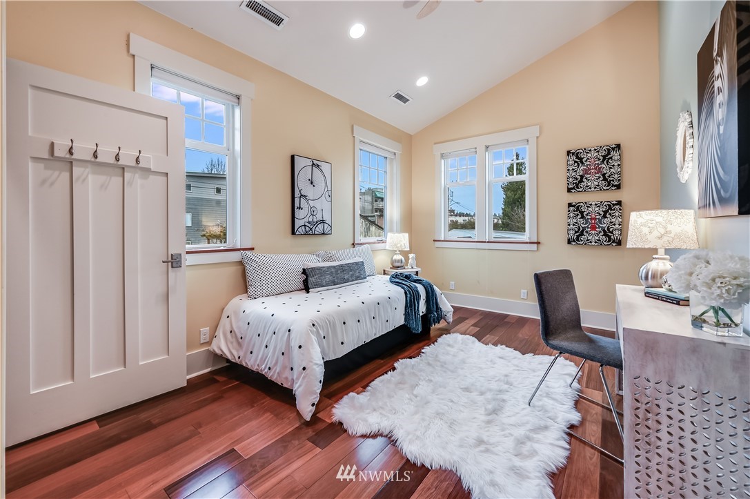 6016 44th Avenue Southwest Seattle, WA 98136 - Photo 24 of 35 a living room with furniture and a wooden floor