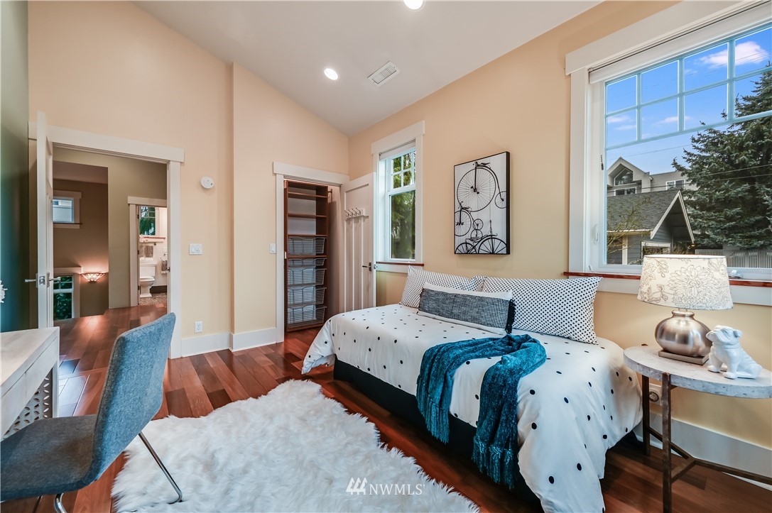 6016 44th Avenue Southwest Seattle, WA 98136 - Photo 25 of 35 a bedroom with a large bed and a couch
