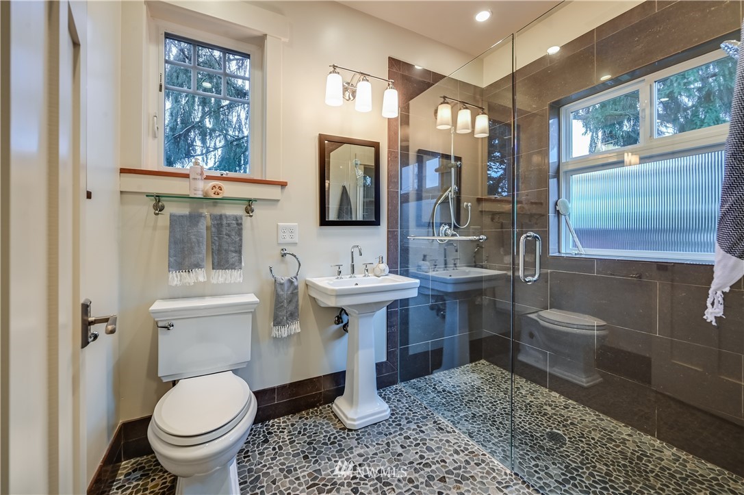 6016 44th Avenue Southwest Seattle, WA 98136 - Photo 26 of 35 a bathroom with a toilet sink and mirror