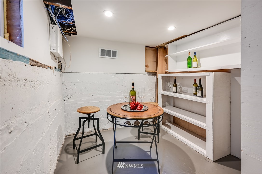 6016 44th Avenue Southwest Seattle, WA 98136 - Photo 29 of 35 a living room with furniture and a table