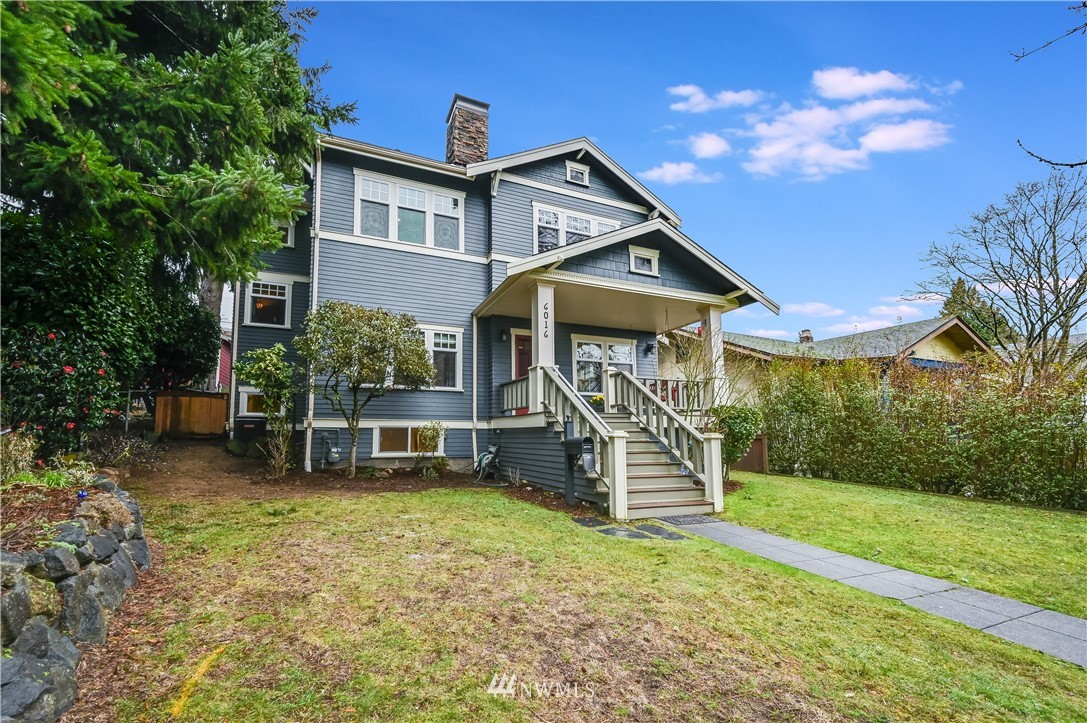 6016 44th Avenue Southwest Seattle, WA 98136 - Photo 3 of 35 front view of house with a yard and potted plants