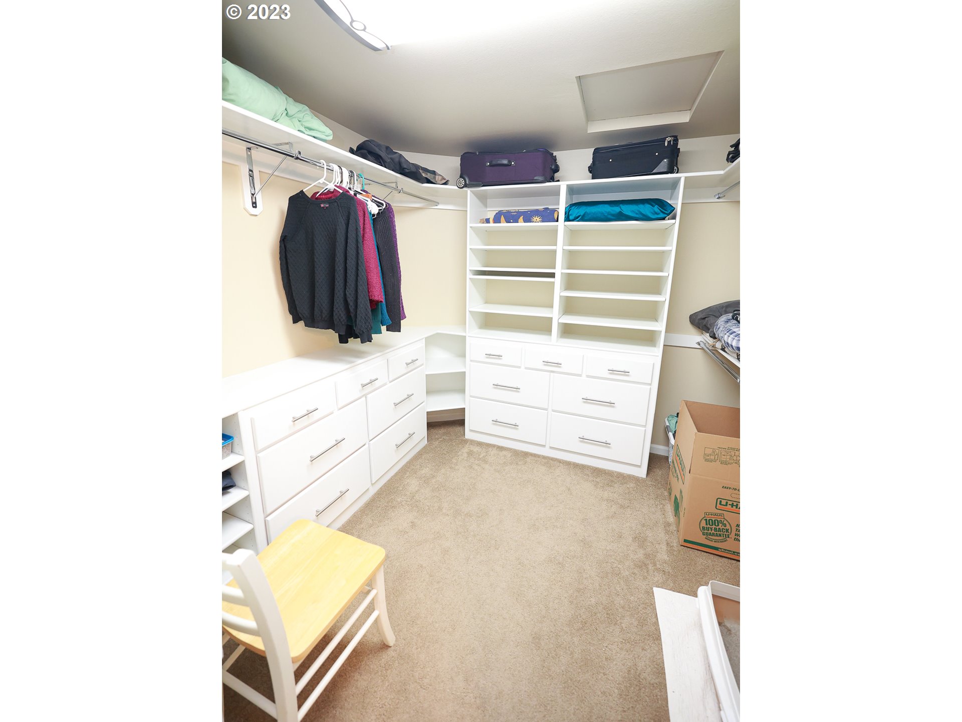 2465 South Bertelsen Road Eugene, OR 97405 - Photo 11 of 26 a view of walk in closet with clothes and shoes