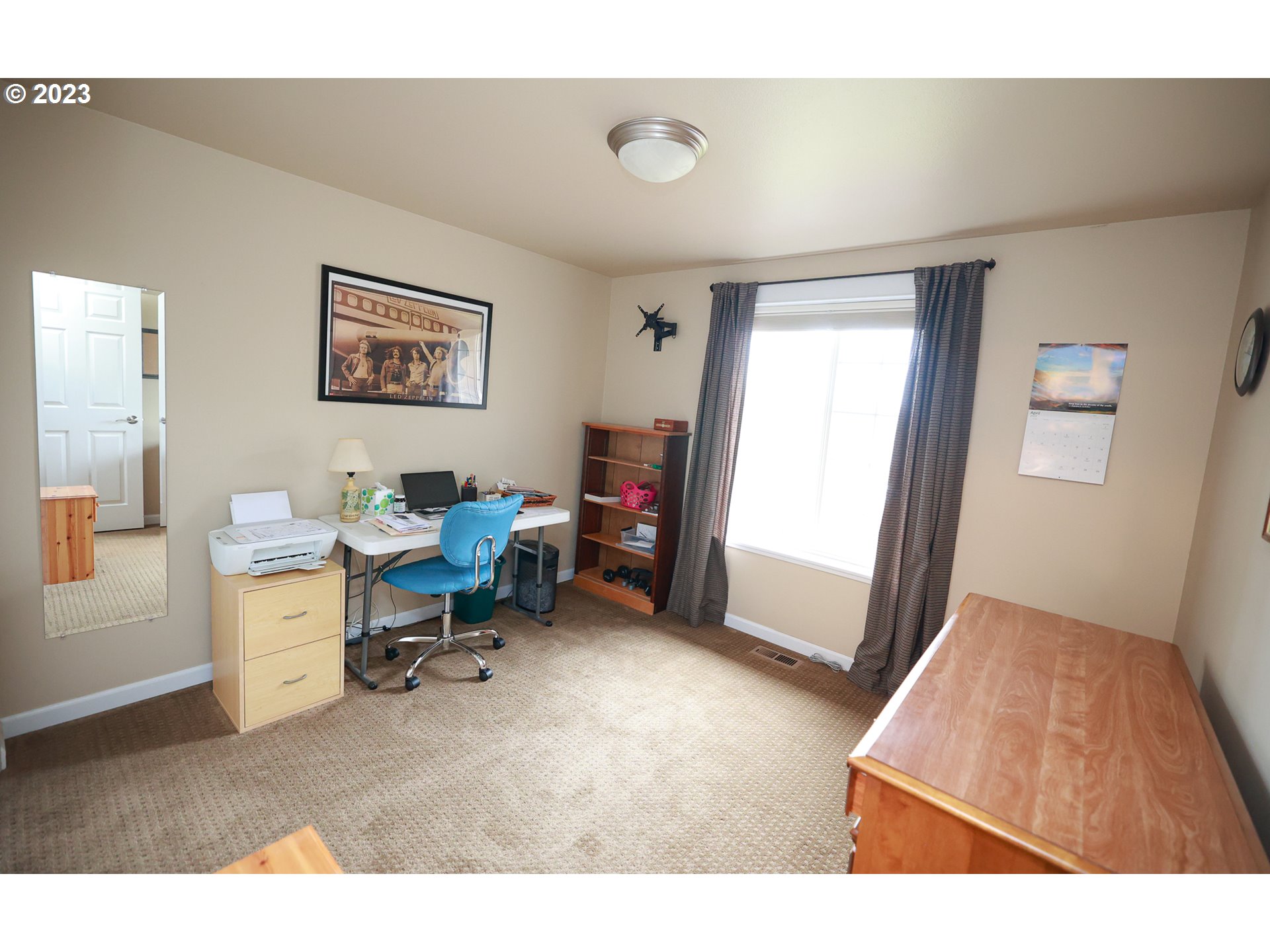 2465 South Bertelsen Road Eugene, OR 97405 - Photo 14 of 26 a living room with furniture and a flat screen tv