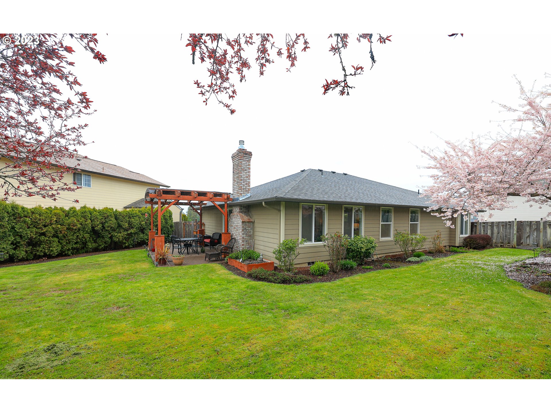 2465 South Bertelsen Road Eugene, OR 97405 - Photo 18 of 26 a front view of a house with garden