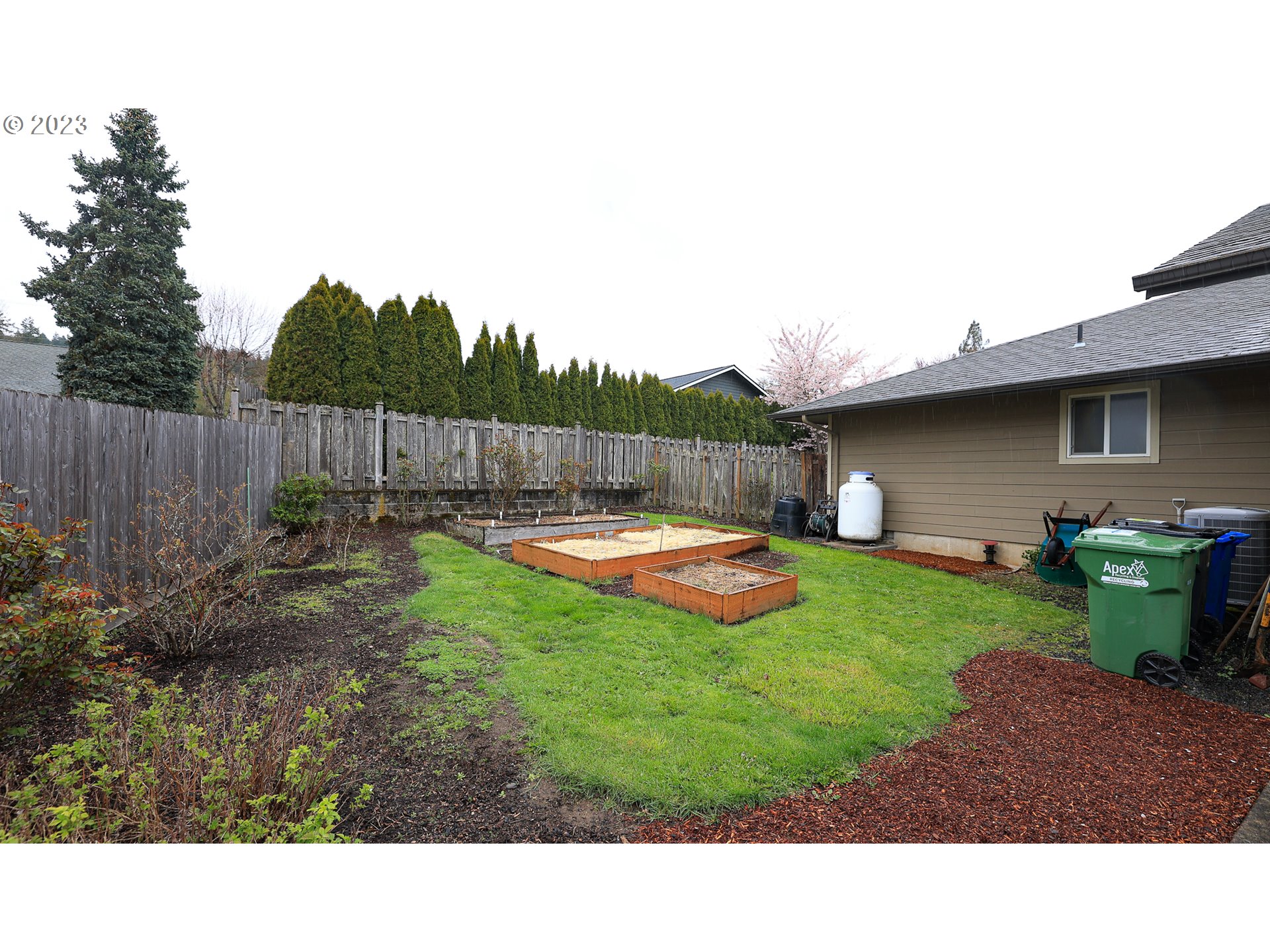 2465 South Bertelsen Road Eugene, OR 97405 - Photo 20 of 26 a view of a backyard with table and chairs