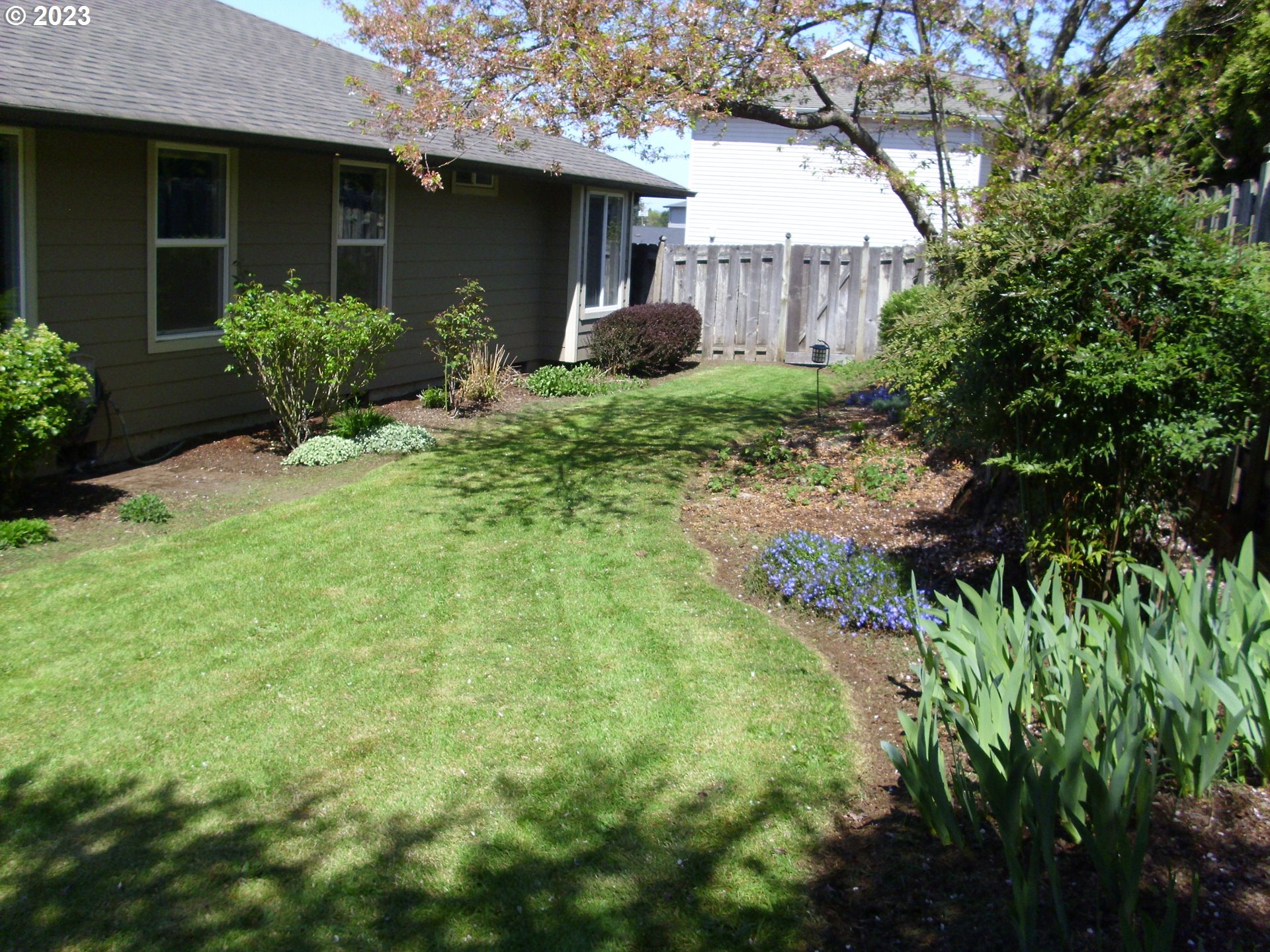 2465 South Bertelsen Road Eugene, OR 97405 - Photo 22 of 26 a view of a house with a yard and sitting area
