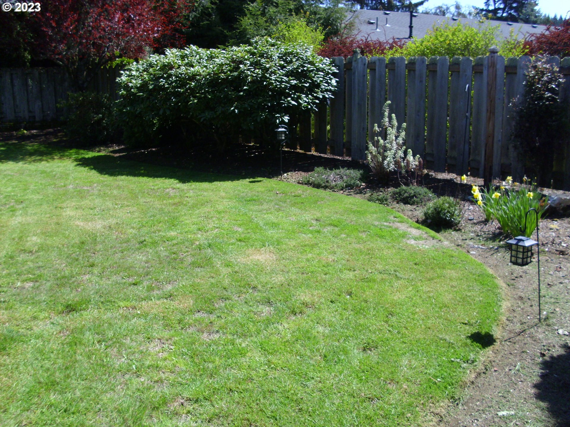 2465 South Bertelsen Road Eugene, OR 97405 - Photo 26 of 26 a view of garden with plants and wooden fence
