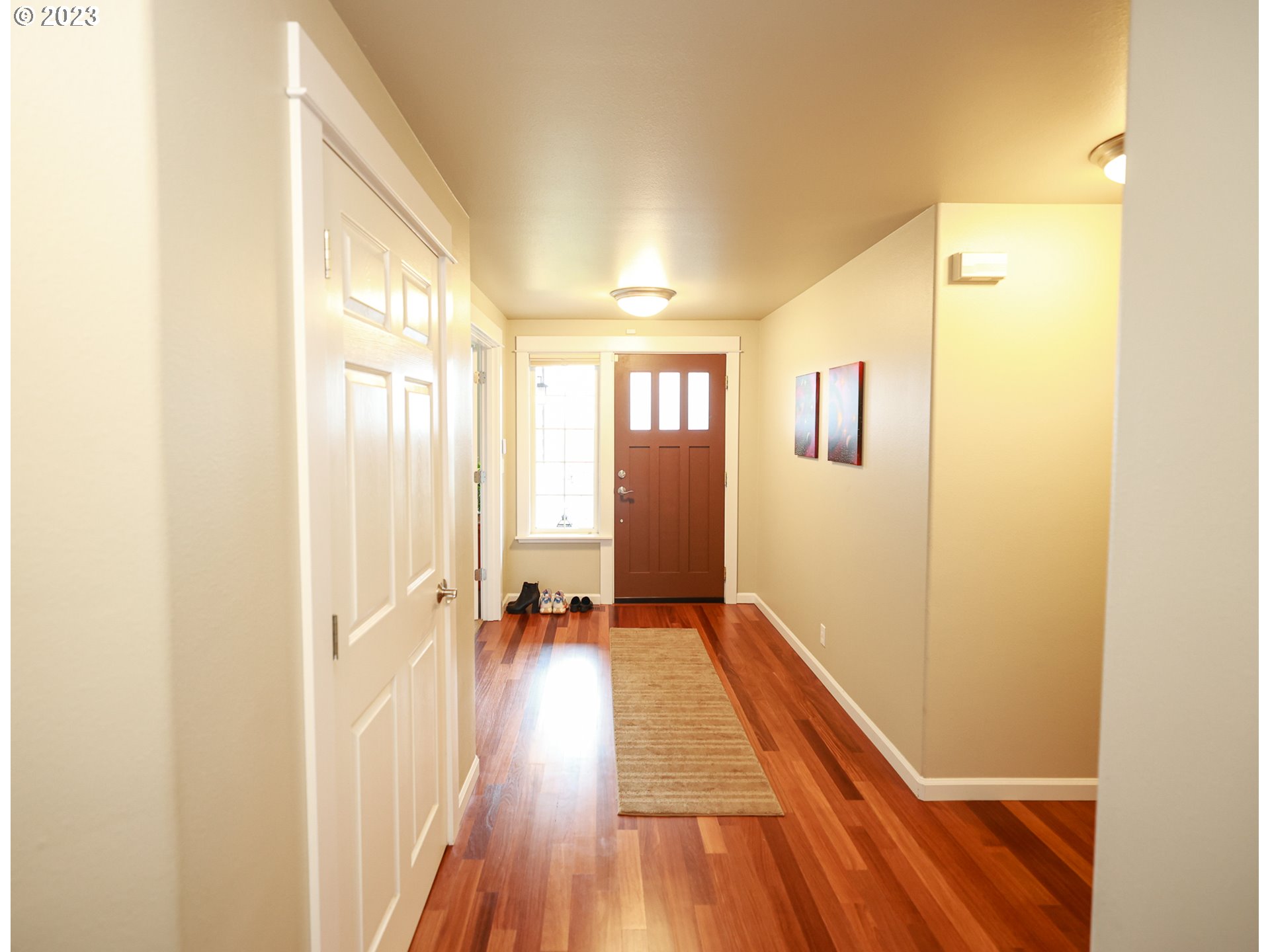 2465 South Bertelsen Road Eugene, OR 97405 - Photo 3 of 26 a view of a room with wooden floor and a bathroom
