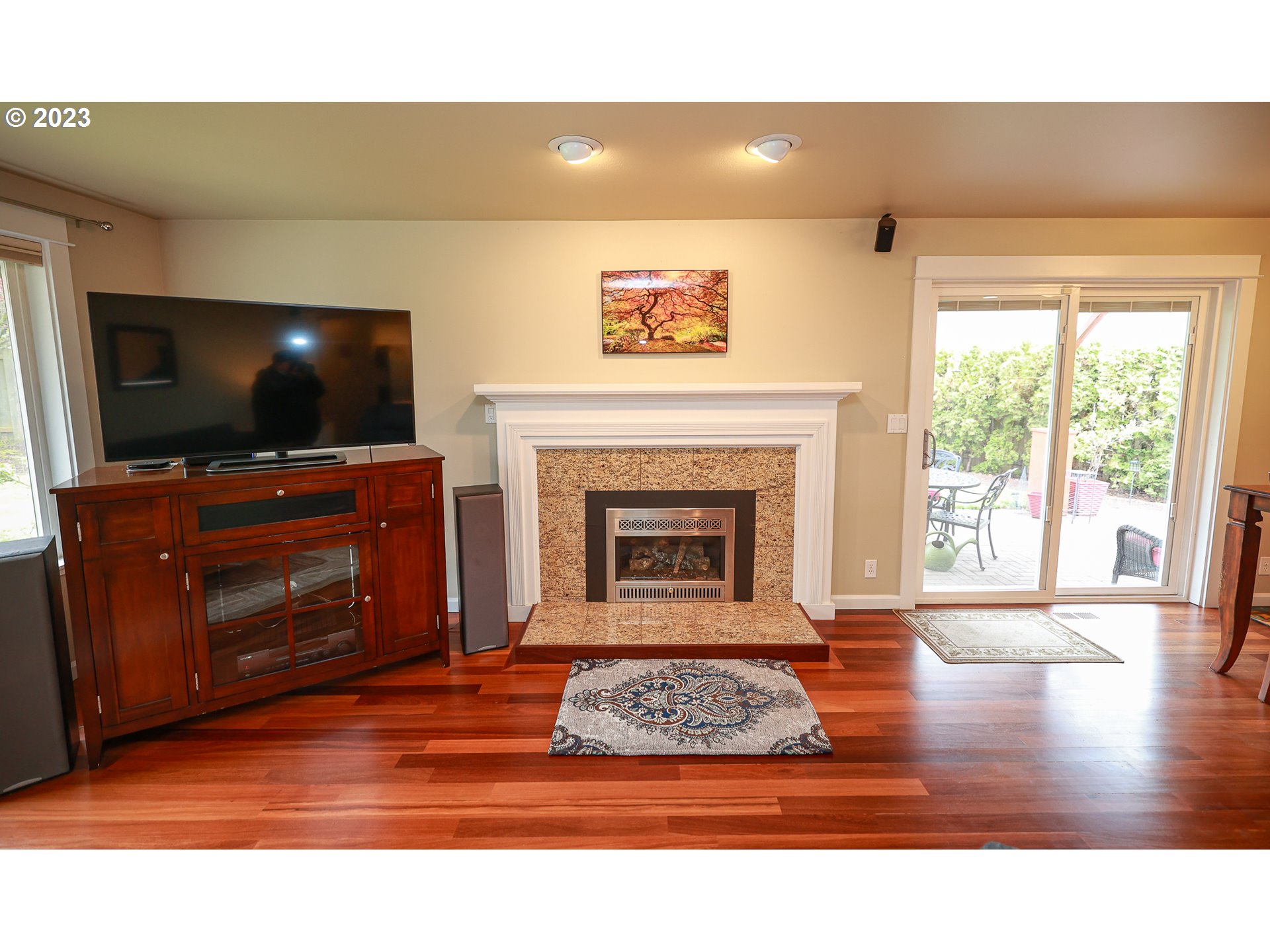 2465 South Bertelsen Road Eugene, OR 97405 - Photo 8 of 26 a living room with a flat screen tv and a fireplace