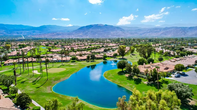 a view of a city with mountains in the background
