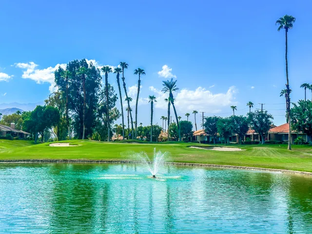 a view of a golf course with a lake view
