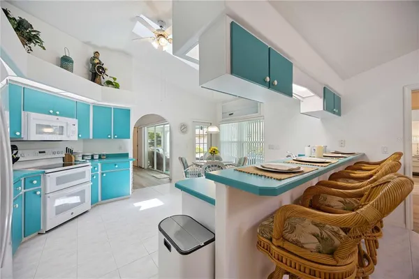 a kitchen with stainless steel appliances granite countertop a sink and cabinets