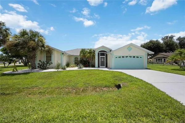 a view of an house with backyard space and garden