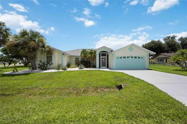 a view of an house with backyard space and garden