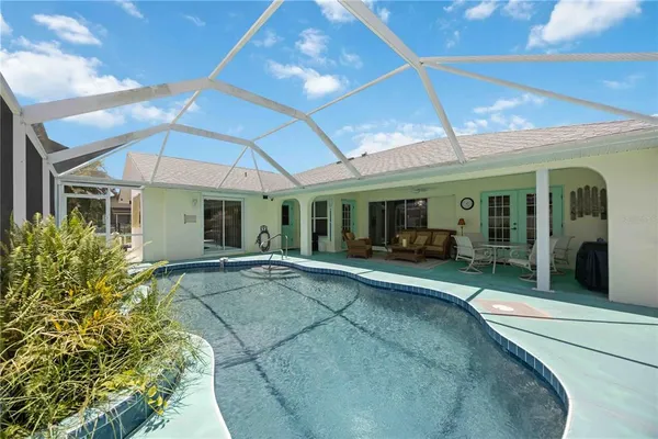 a view of a house with sitting area and garden