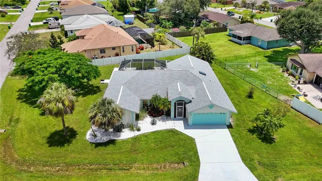 an aerial view of a house with garden