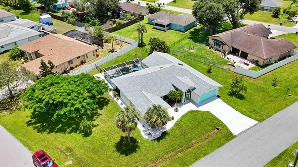 an aerial view of house with yard