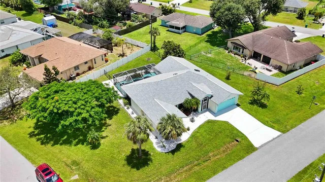 an aerial view of house with yard