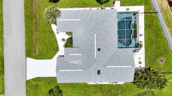 an aerial view of a house with a swimming pool