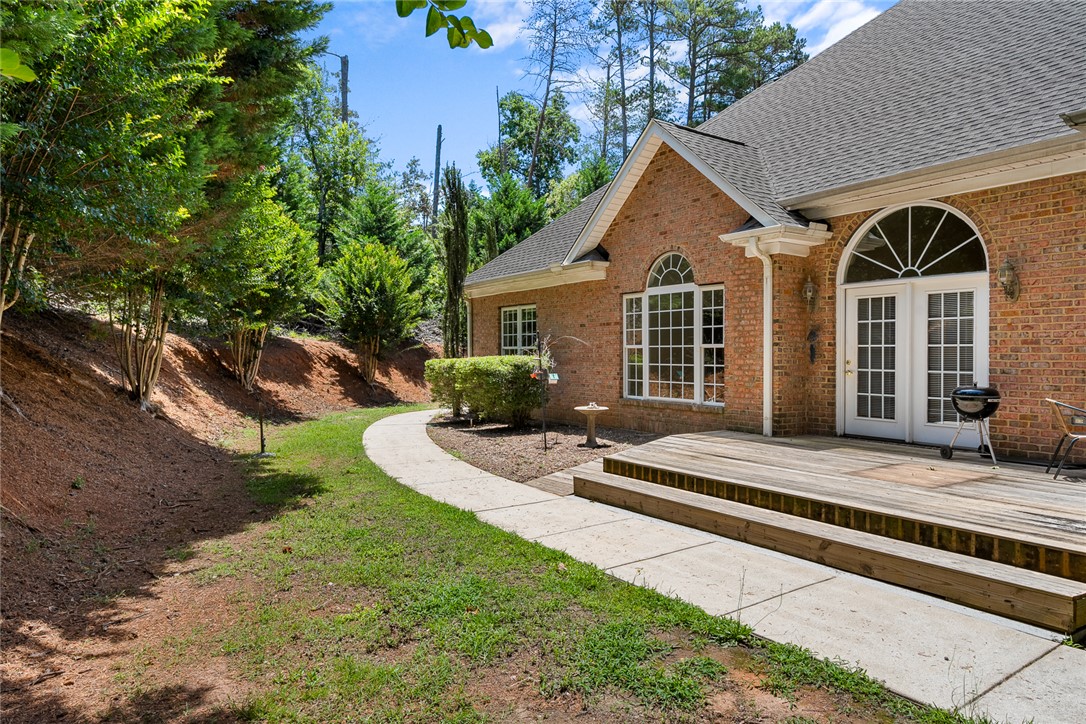 135 Sunset Bay Boulevard Seneca, SC 29672 - Photo 43 of 50 A classic brick exterior offers timeless appeal with a spacious deck perfect for entertaining.
