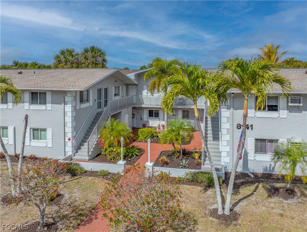 8141 Country Road, Unit 202 Fort Myers, FL 33919 - Photo 1 of 22 a view of a house with a patio