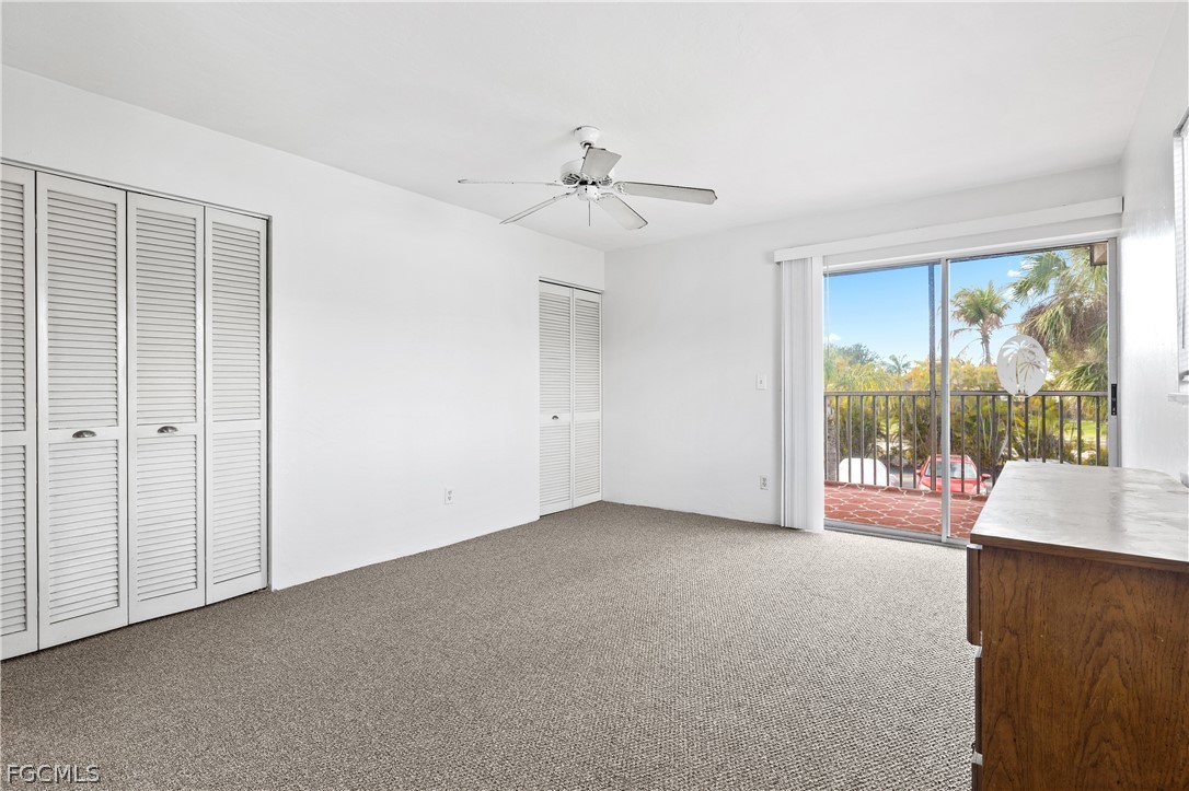 8141 Country Road, Unit 202 Fort Myers, FL 33919 - Photo 15 of 22 an empty room with windows and outdoor view