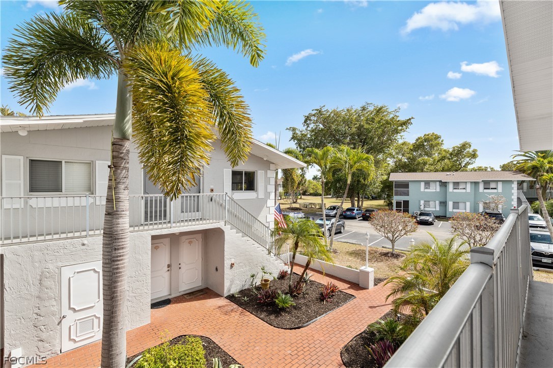 8141 Country Road, Unit 202 Fort Myers, FL 33919 - Photo 22 of 22 a view of a patio with couches chairs and potted plants