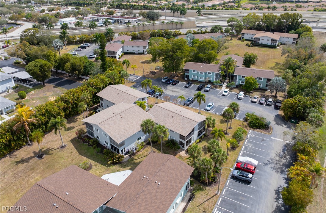 8141 Country Road, Unit 202 Fort Myers, FL 33919 - Photo 7 of 22 an aerial view of a house with garden space and street view