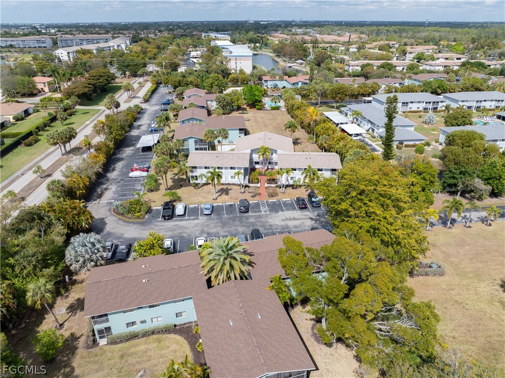 8141 Country Road, Unit 202 Fort Myers, FL 33919 - Photo 9 of 22 an aerial view of residential houses with outdoor space