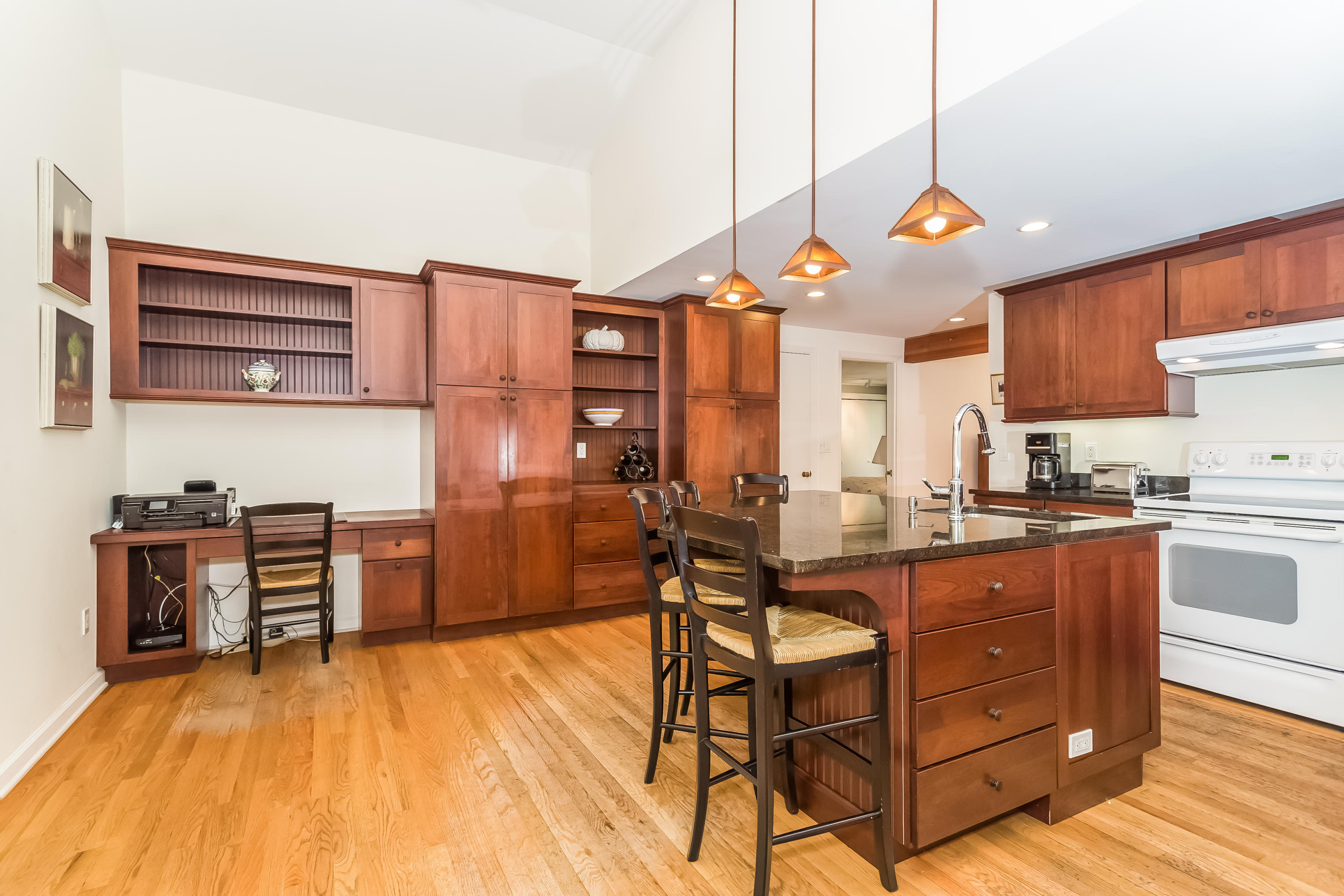 9 Little Brook Road Rowayton, CT 06853 - Photo 13 of 35 a kitchen with stainless steel appliances granite countertop a stove a sink dishwasher and a refrigerator with wooden floor