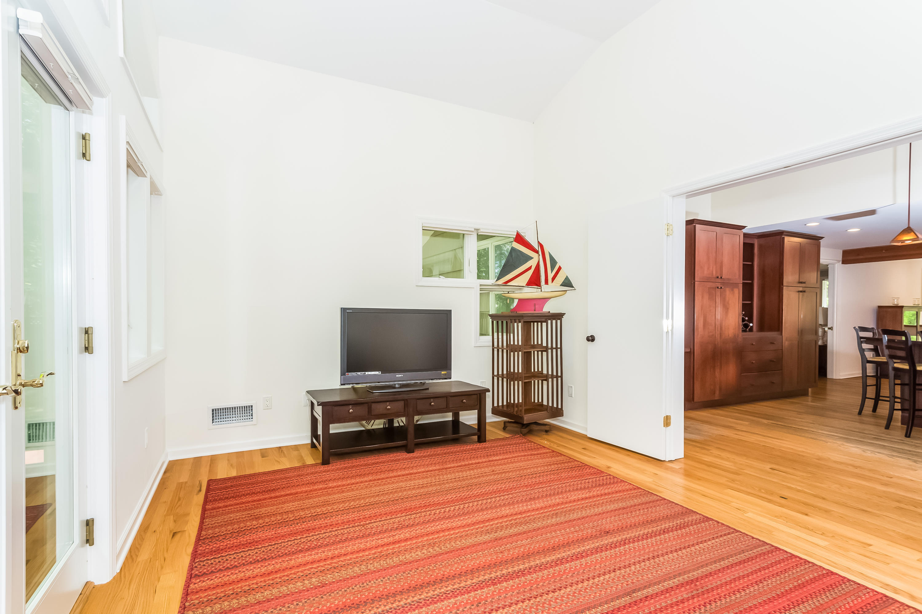 9 Little Brook Road Rowayton, CT 06853 - Photo 16 of 35 a view of a livingroom with wooden floor and furniture