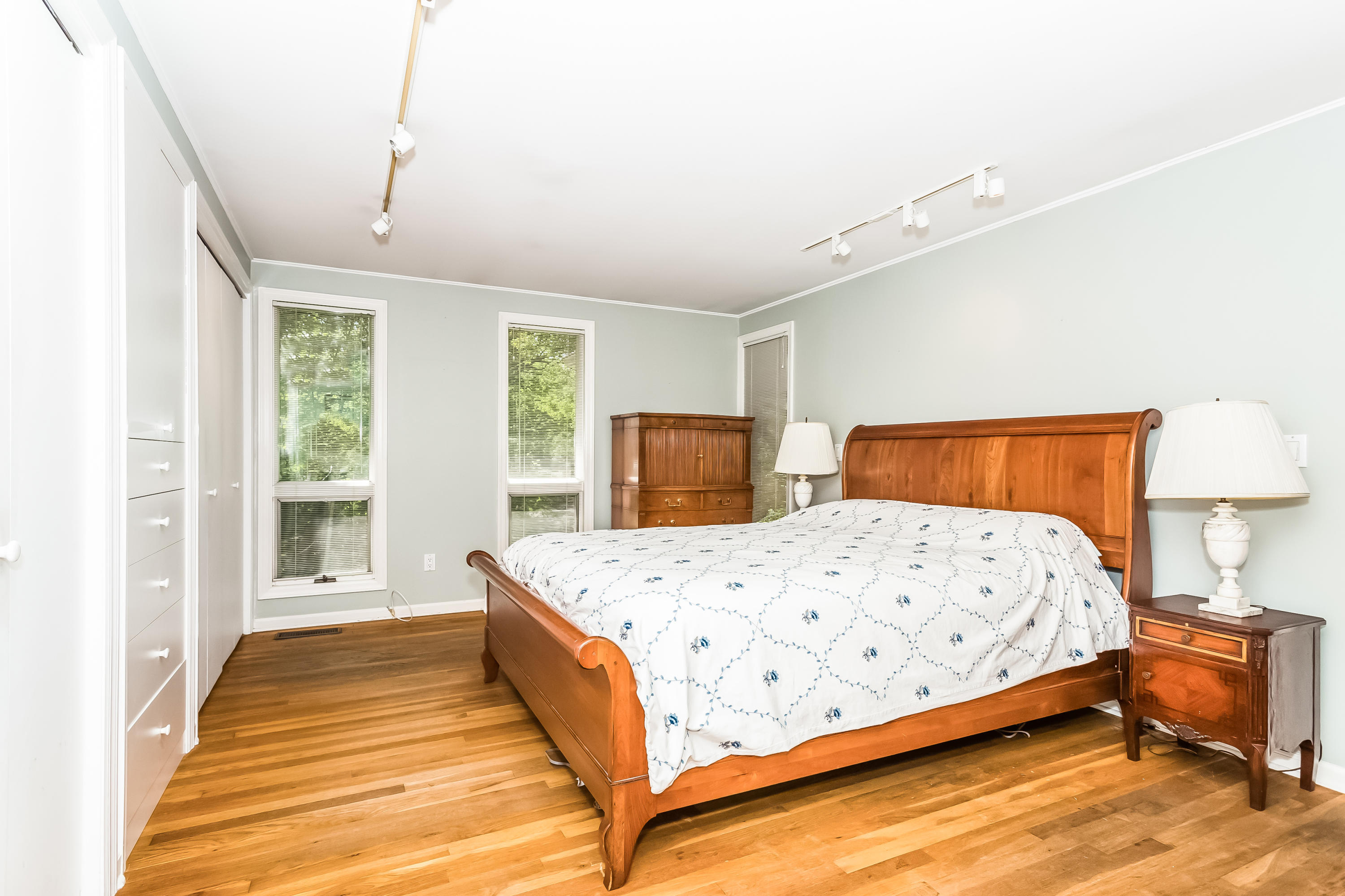 9 Little Brook Road Rowayton, CT 06853 - Photo 18 of 35 a bedroom with a bed and wooden floor