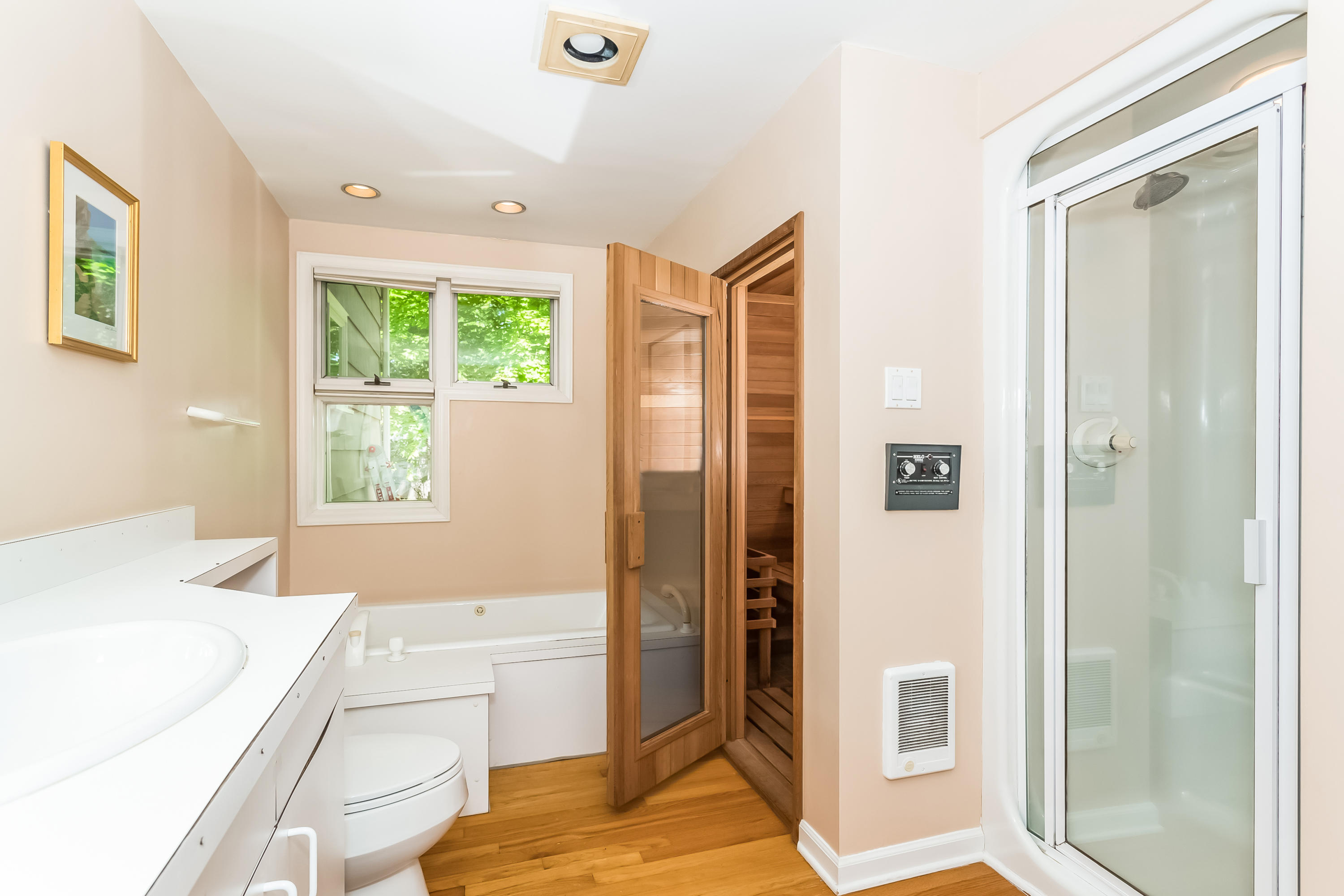 9 Little Brook Road Rowayton, CT 06853 - Photo 20 of 35 a spacious bedroom with a bed and a window