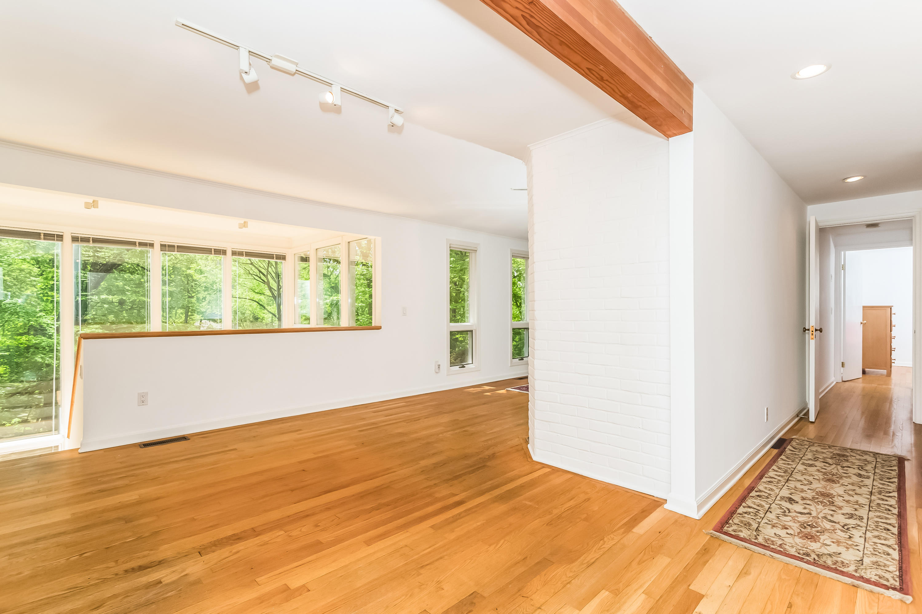 9 Little Brook Road Rowayton, CT 06853 - Photo 27 of 35 a view of an empty room with wooden floor and a window