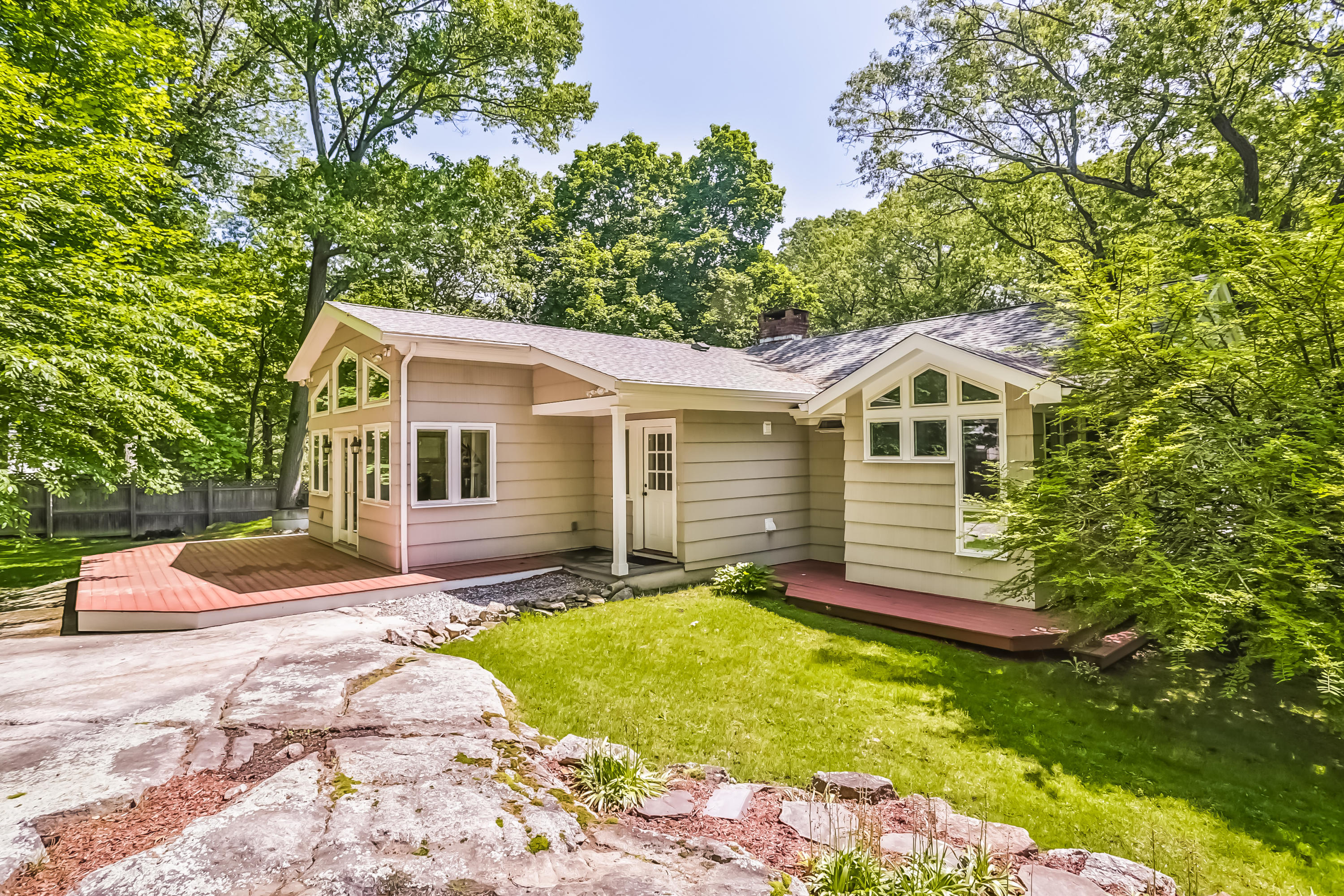 9 Little Brook Road Rowayton, CT 06853 - Photo 29 of 35 a view of a house with a yard