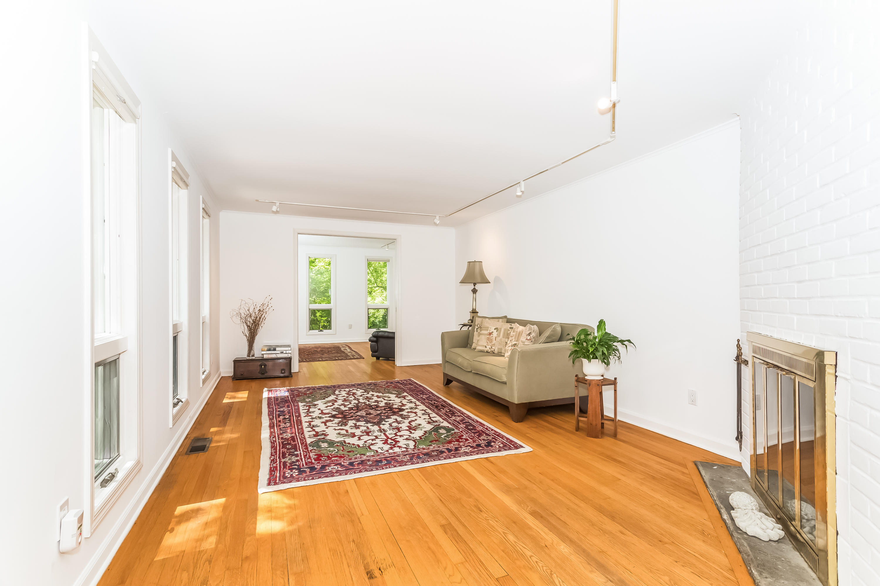 9 Little Brook Road Rowayton, CT 06853 - Photo 7 of 35 a bedroom with a bed and wooden floor