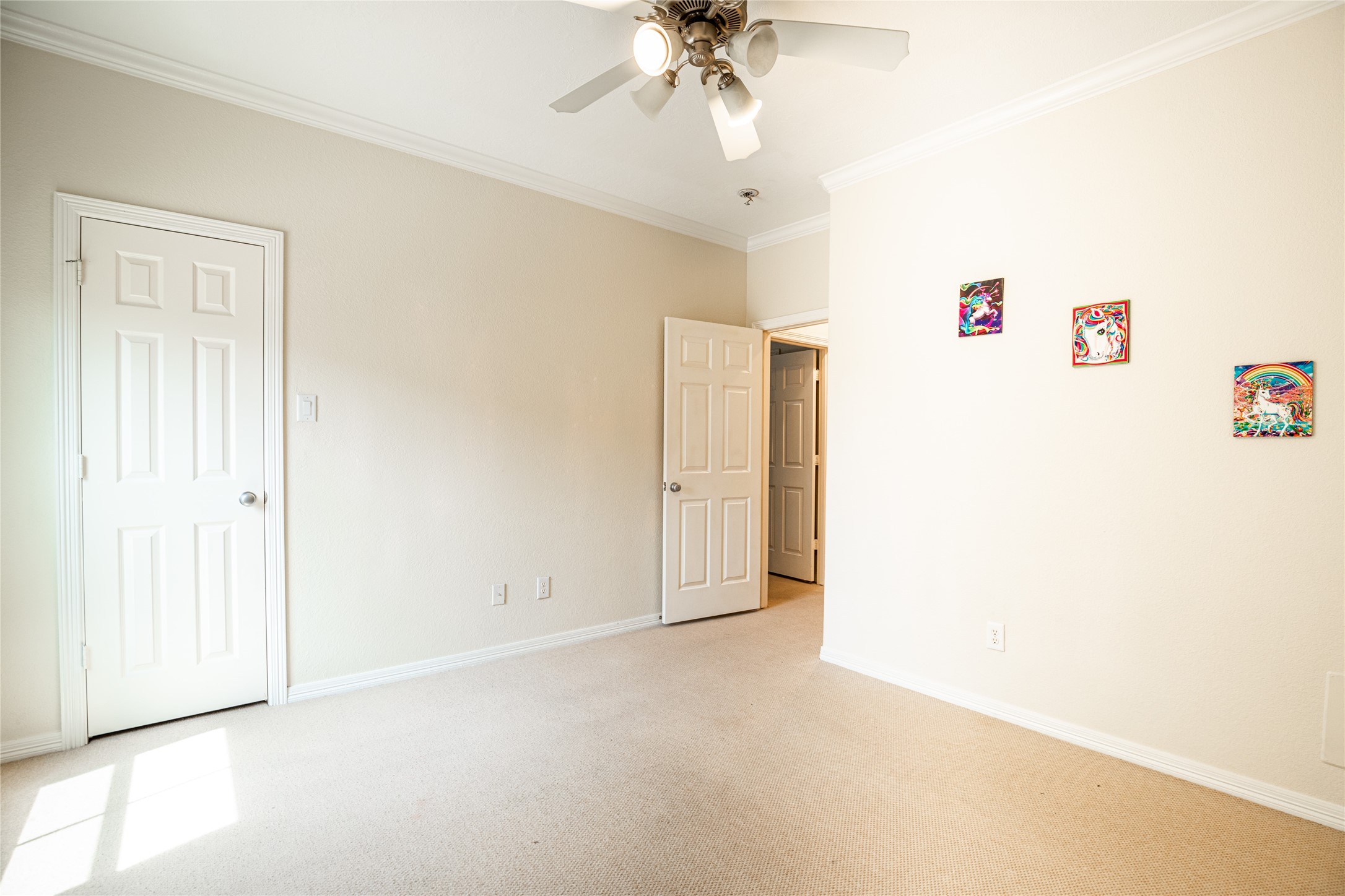 2923 Royal Oaks Crest Houston, TX 77082 - Photo 23 of 31 an empty room with a ceiling fan and a window