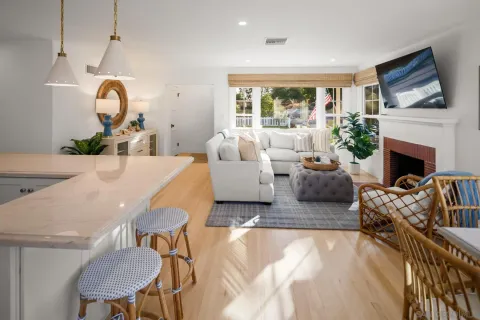 a living room with furniture fireplace and a flat screen tv