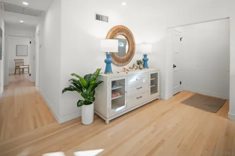 a bed room with a bed and a potted plant