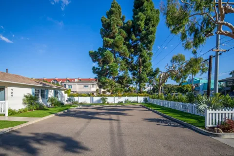 a view of a street with a houses